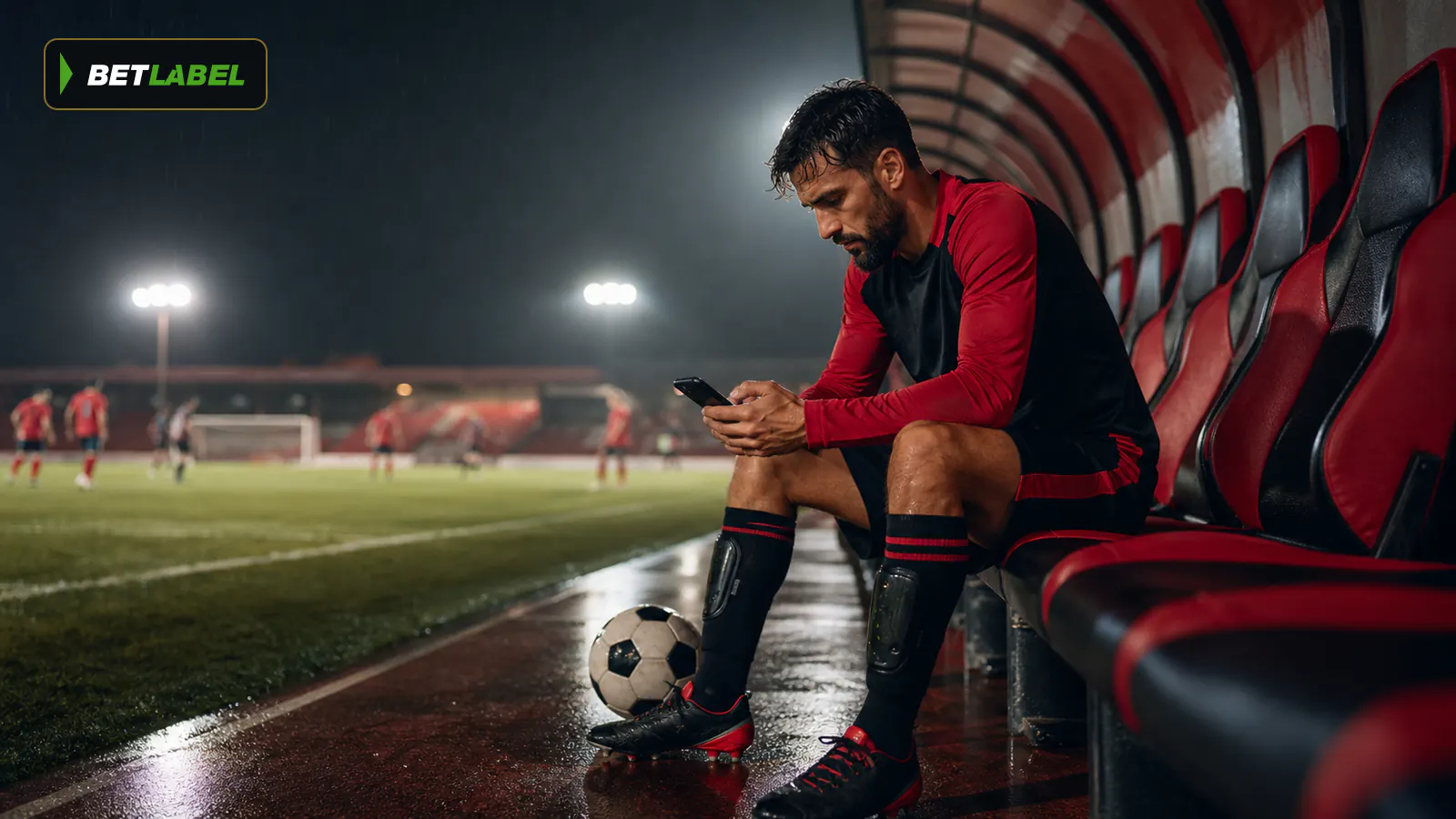 Aficionado adulto usa una aplicación durante un partido de fútbol en directo